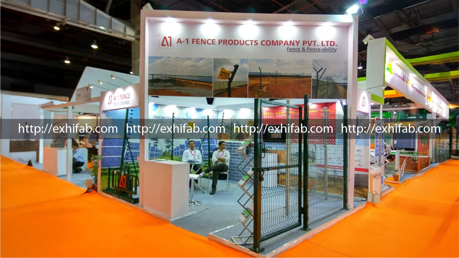 A-1 Fence Products exhibition stall displaying physical fencing samples, application photos and a live perimeter-security demo