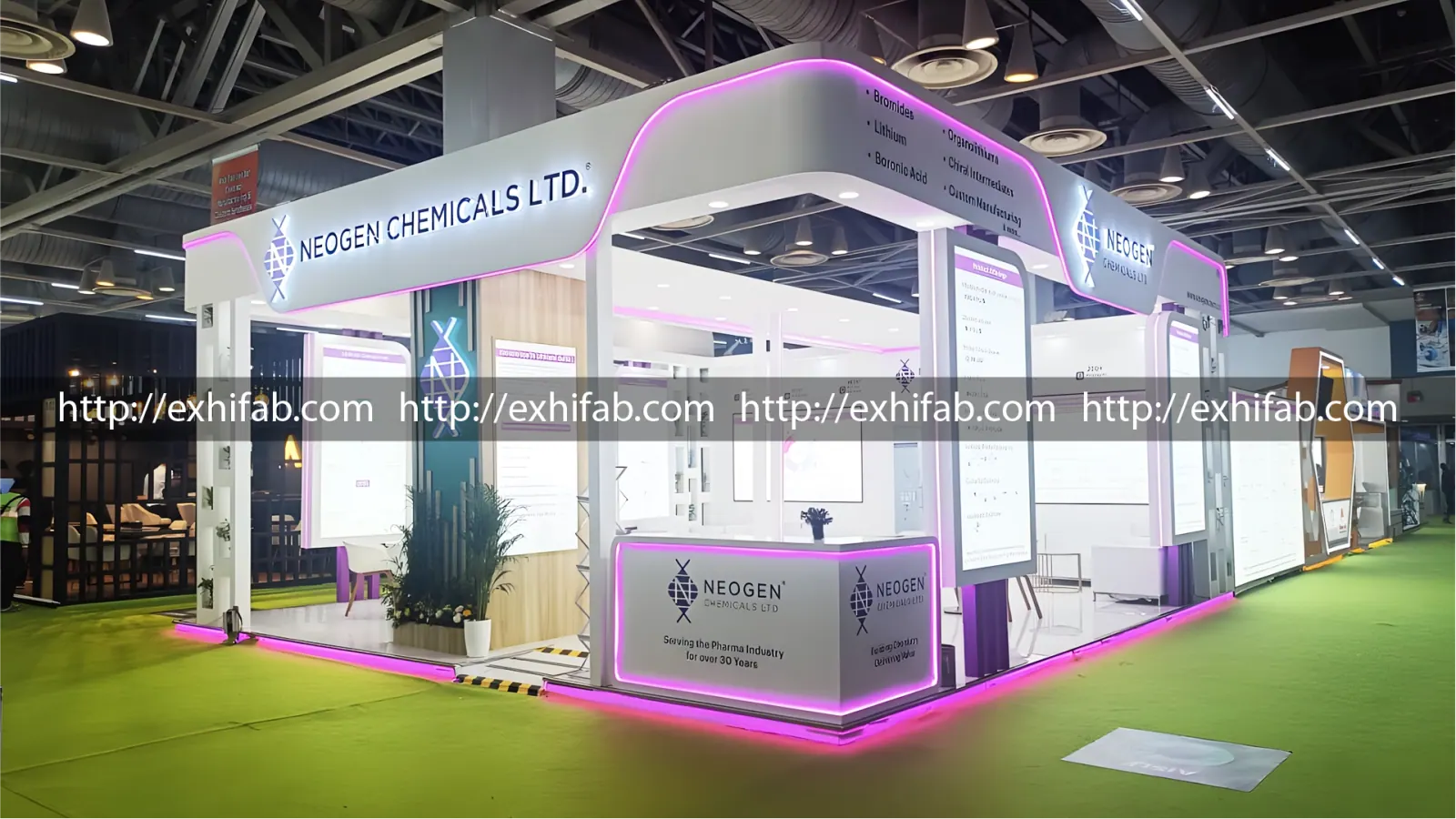 Neogen Chemicals custom exhibition stall with magenta LED accent lighting and open-plan meeting lounge at CPHI India